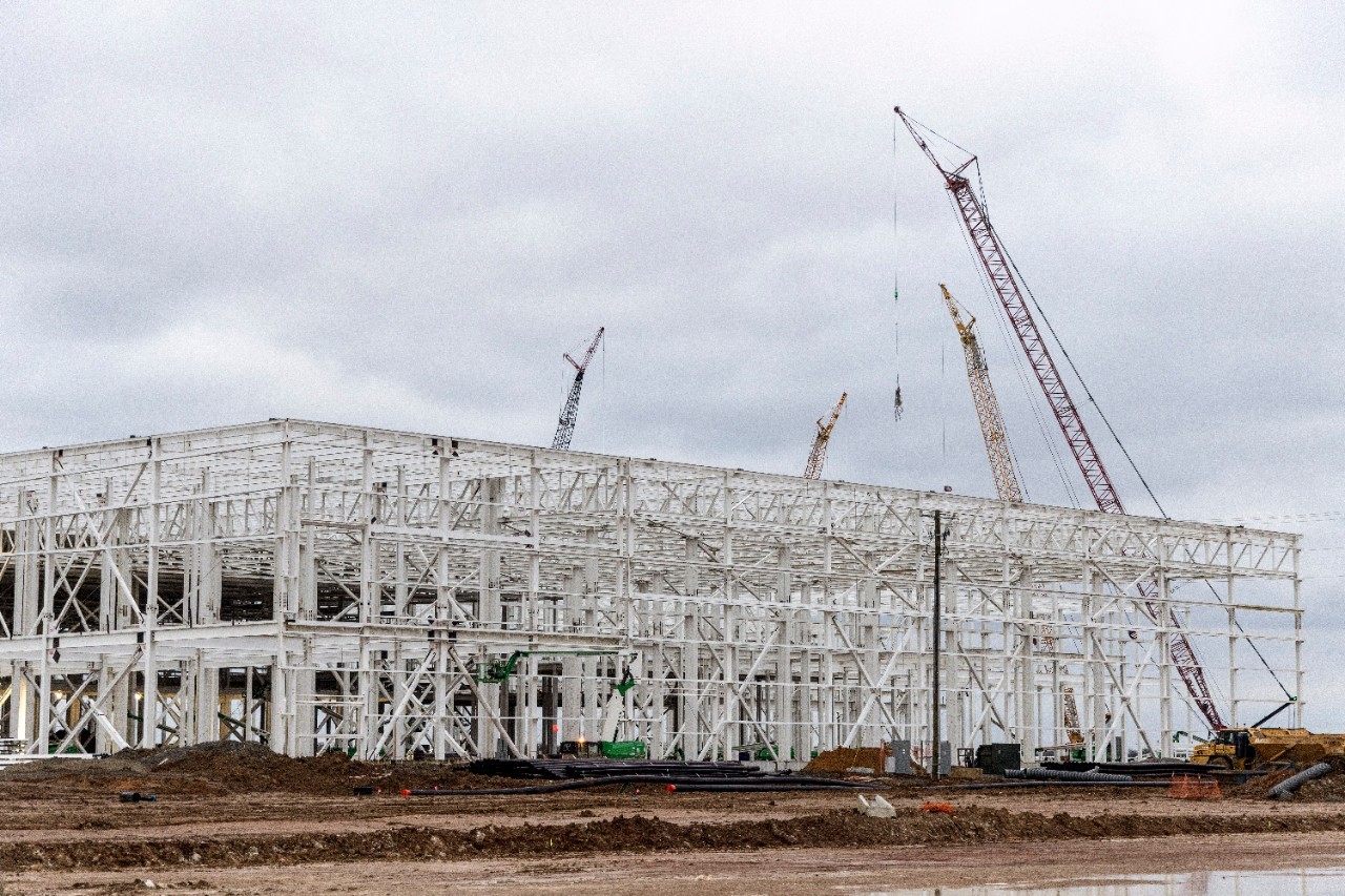 View of Blue Oval City facility udner construction with cranes in the background