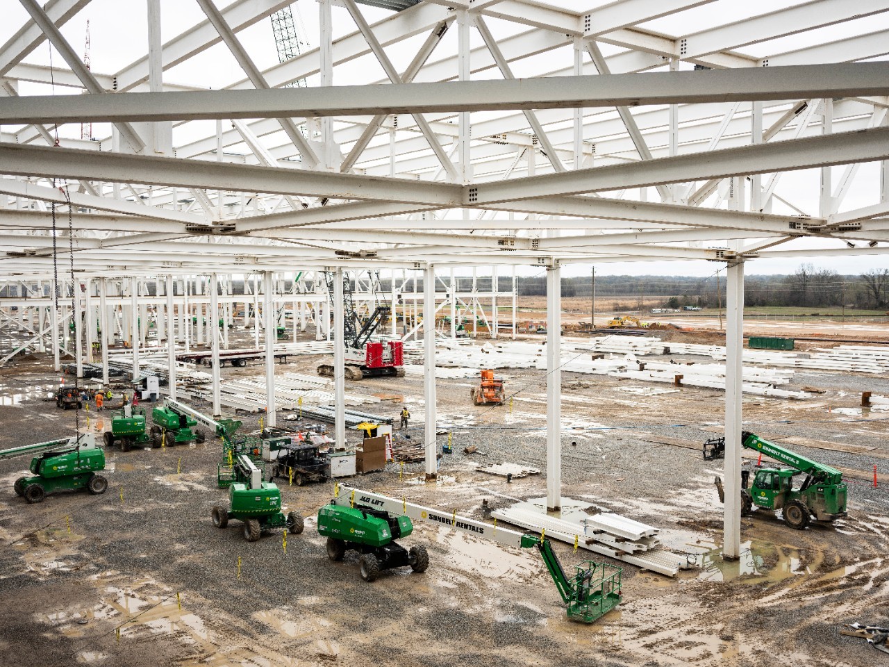 Interior view of Blue Oval City facility under construction with equipment  in the foreground